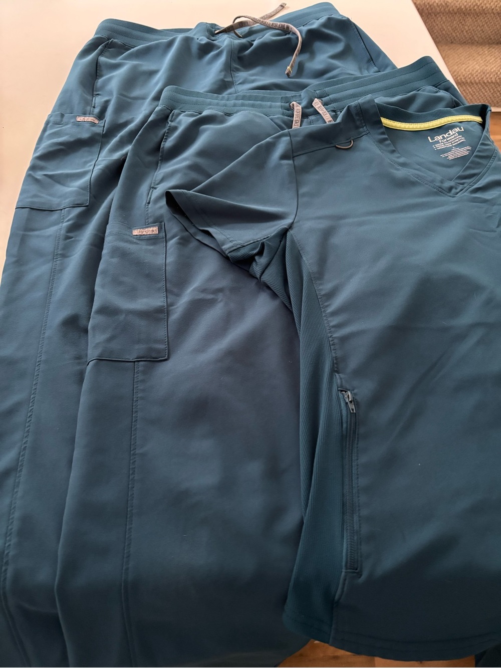 Landau Forward Teal V-Neck Scrub Top with 2 pairs of scrub pants. All large